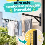 Un tendeur pliable suspendu dans une buanderie moderne et bien organisée.